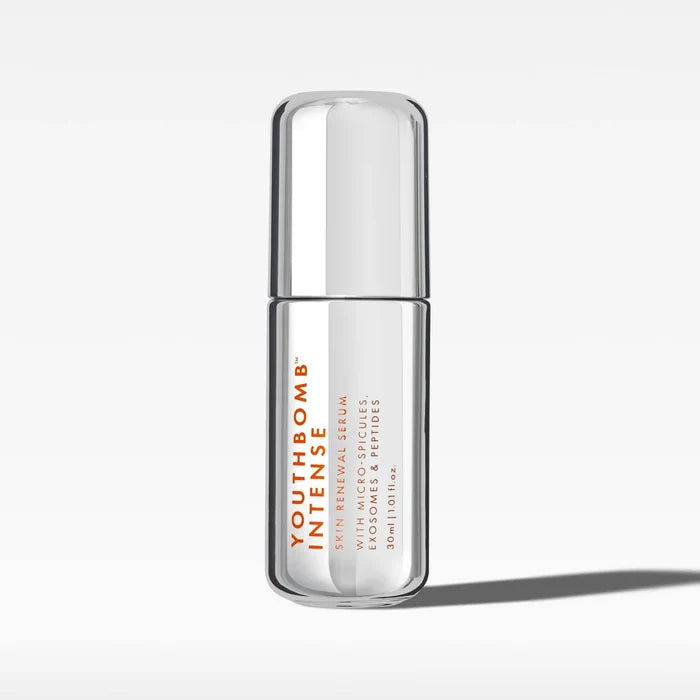 Beauty Pie Youthbomb Intense Skin Renewal Serum 30ml, clear glass bottle with pump dispenser, close-up of product label.