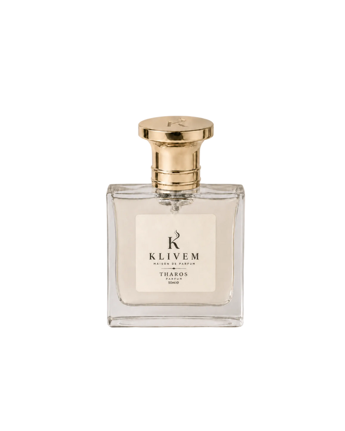 A 50ml clear glass perfume bottle with a shiny gold cap and a cream-colored label. The label features the brand name 'KLIVEM' and the scent name 'THAROS'.