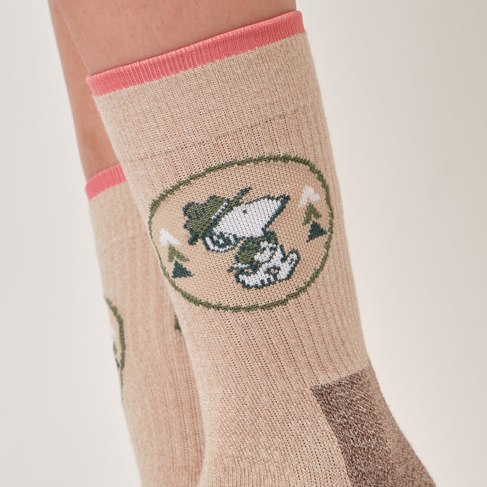 Ivory oat marl crew compression socks with a Beagle Scouts badge design, worn in a lifestyle setting.