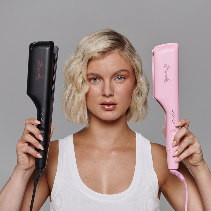 Model with short blonde hair using the Mermade Hair Double Waver - Black