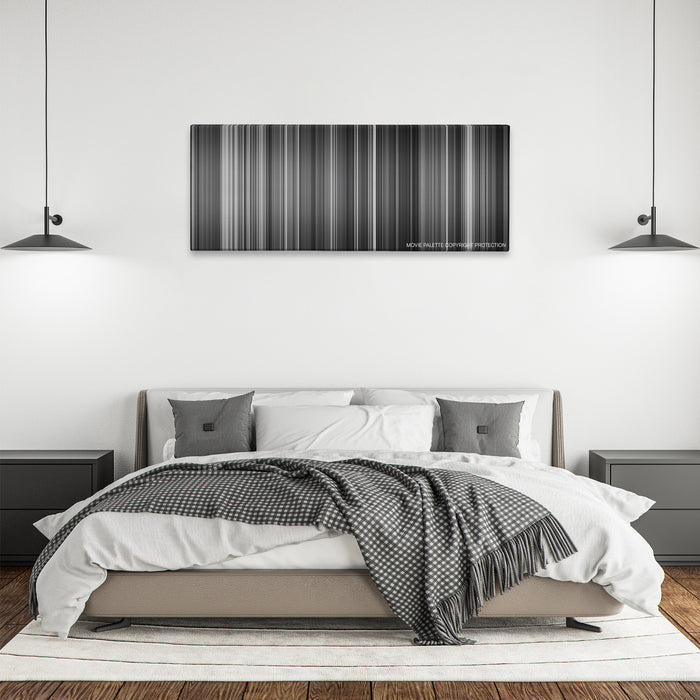 Hara-Kiri color palette canvas above a bed, between two black pendant lamps