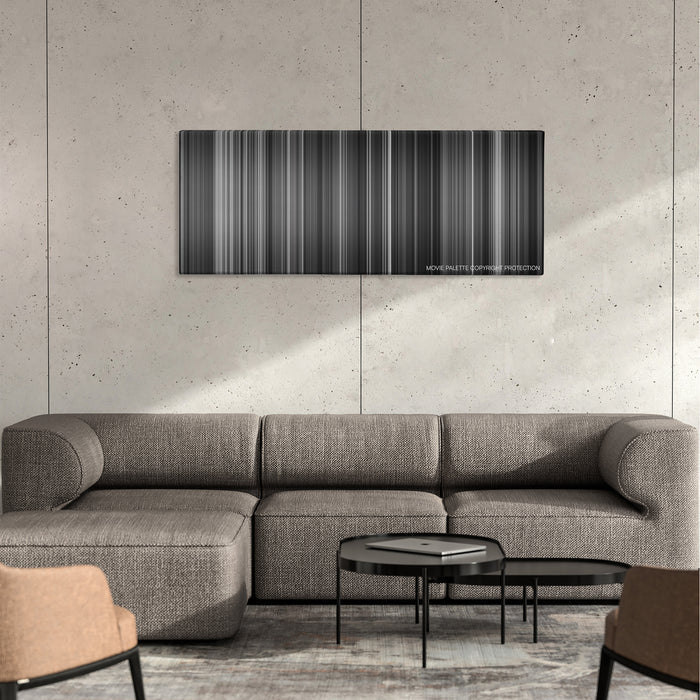 Hara-Kiri color palette canvas on a concrete wall above a gray sectional sofa