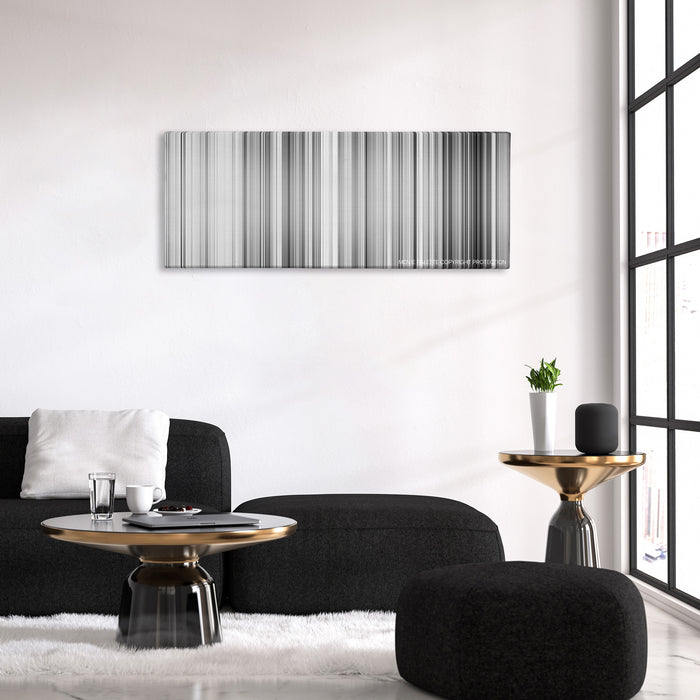 High and Low color palette canvas above a black sofa with a gold-topped table