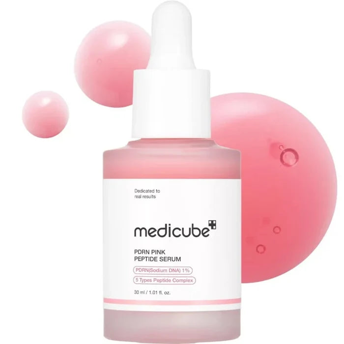 Medicube PDRN Pink Peptide Serum 30ml, a facial serum in a clear bottle with a pink cap, showcasing its smooth, hydrating formula.