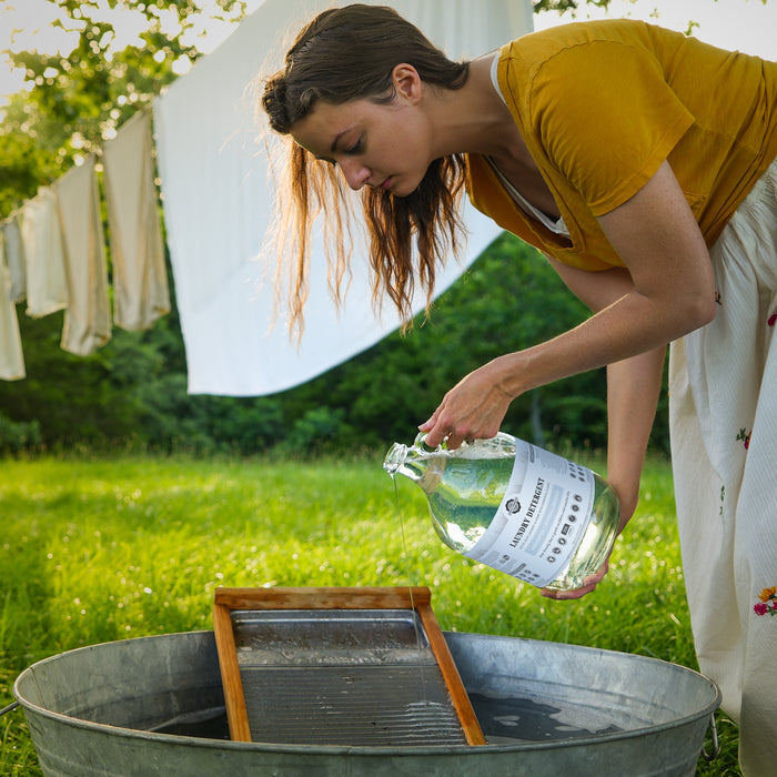 Woman pouring out of a Rustic Strength  bottle.