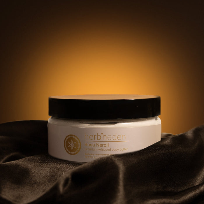 Herb'N Eden Rosa Neroli premium whipped body butter jar with warm golden background