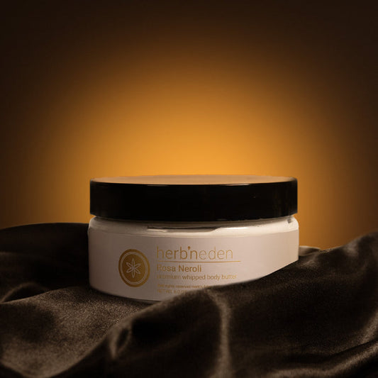 Herb'N Eden Rosa Neroli premium whipped body butter jar with warm golden background