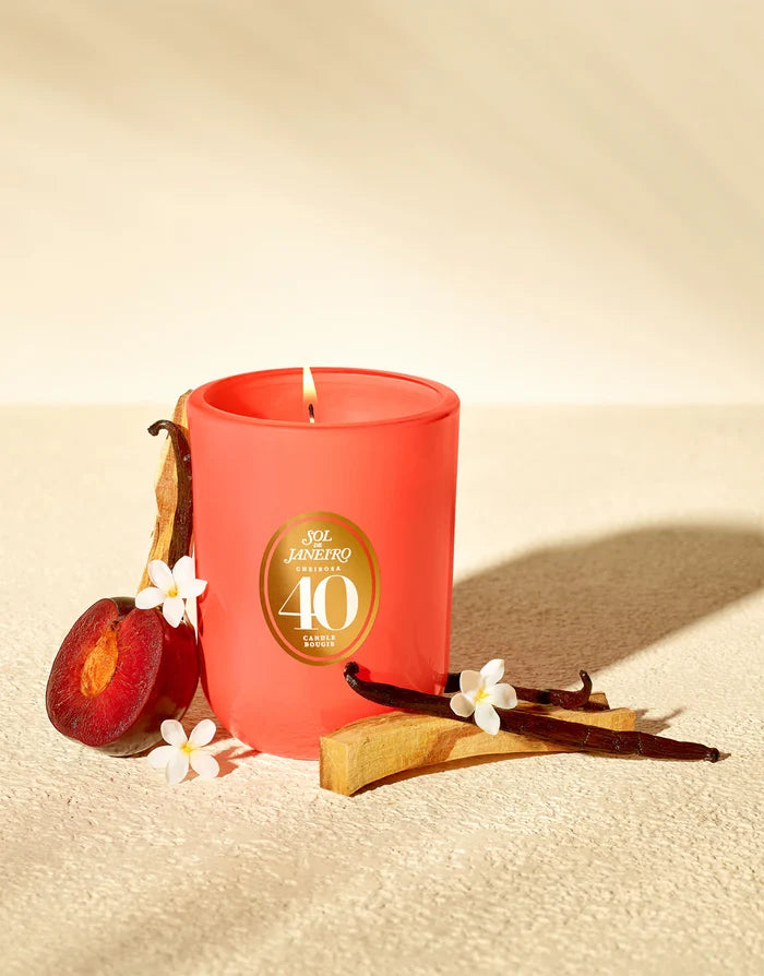 Sol de Janeiro Cheirosa '40' scented candle in a glass jar, showcasing the luxurious candle with a warm, inviting glow.