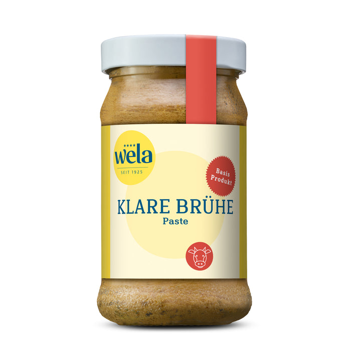 Wela Klare Brühe Paste - Glas mit heller Suppenpaste, gelb-weißem Vorderseitenetikett und roter Banderole.