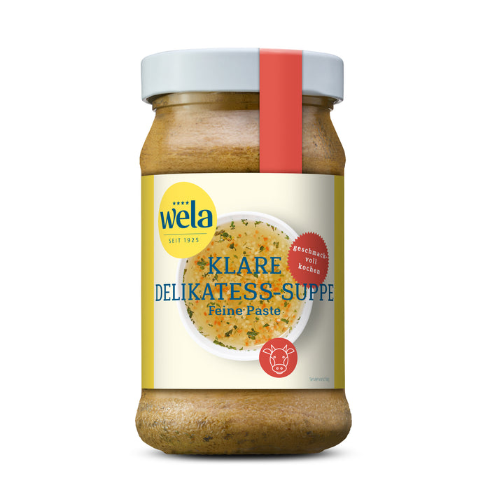 Wela Klare Delikatess-Suppe Feine Paste - Glas mit heller Suppenpaste, gelb-weißem Vorderseitenetikett, roter Banderole, Motiv einer Brühe.