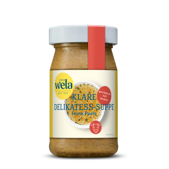 Wela Klare Delikatess-Suppe Feine Paste - kleines Glas mit heller Suppenpaste, gelb-weißem Vorderseitenetikett, roter Banderole, Motiv einer Brühe.
